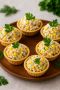 Праздничные тарталетки с тунцом и кукурузой: быстро и вкусно для новогоднего стола